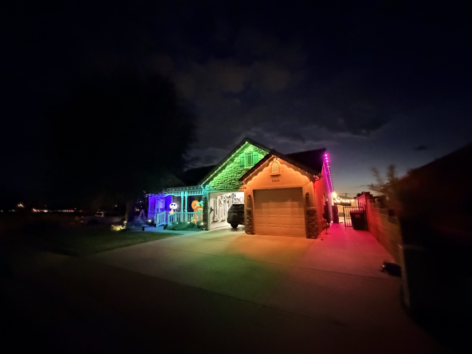 Colorful permanent lighting on the same house for Halloween